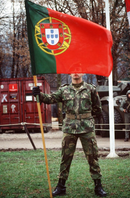 a-portuguese-army-soldier-bears-the-national-flag-and-ensign-of-portugal-during-558575-1024.jpg