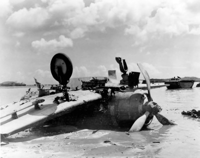 Wreckage of a flipped D3A Type 99 carrier based dive bomber at Agat Beachhead on Guam.jpg