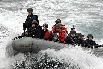 US_Navy_100415-N-1559J-051_Members_of_the_visit,_board,_search_and_seizure_team_from_of_the_guided-missile_destroyer_USS_Laboon_(DDG_58)_approach_a_target_ship.jpg