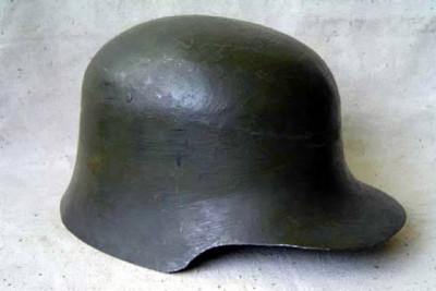 An experimental helmet designed by Military Intendant 1st Class A.A. Schwartz, one of the Soviet variations of the German Stahlhelm design, without ventilation openings and with an elongated visor..jpg